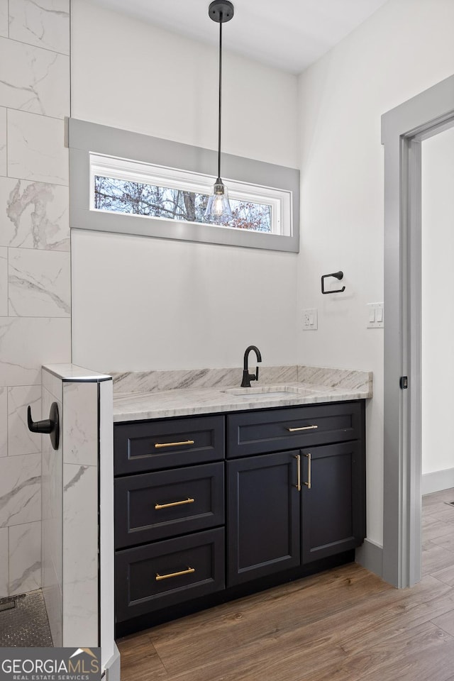 1145 Daniels Rd, Trenton, GA 30752 - bar featuring decorative light fixtures, a sink, and light wood-type flooring