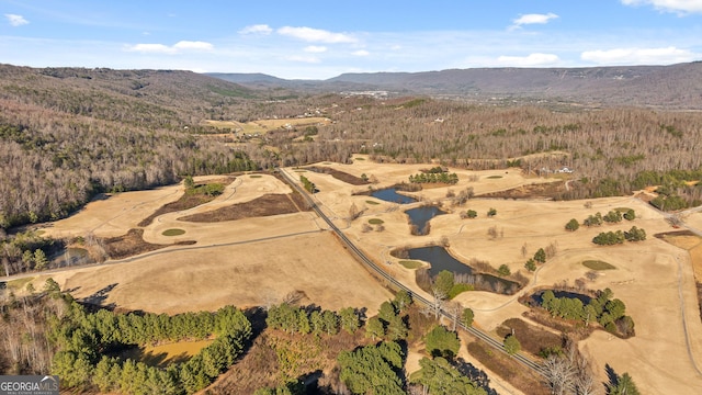 aerial view featuring a water and mountain view