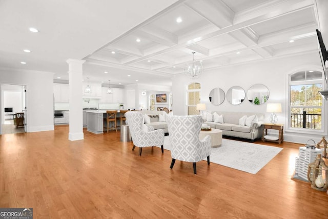living area with recessed lighting, light wood finished floors, beam ceiling, and coffered ceiling