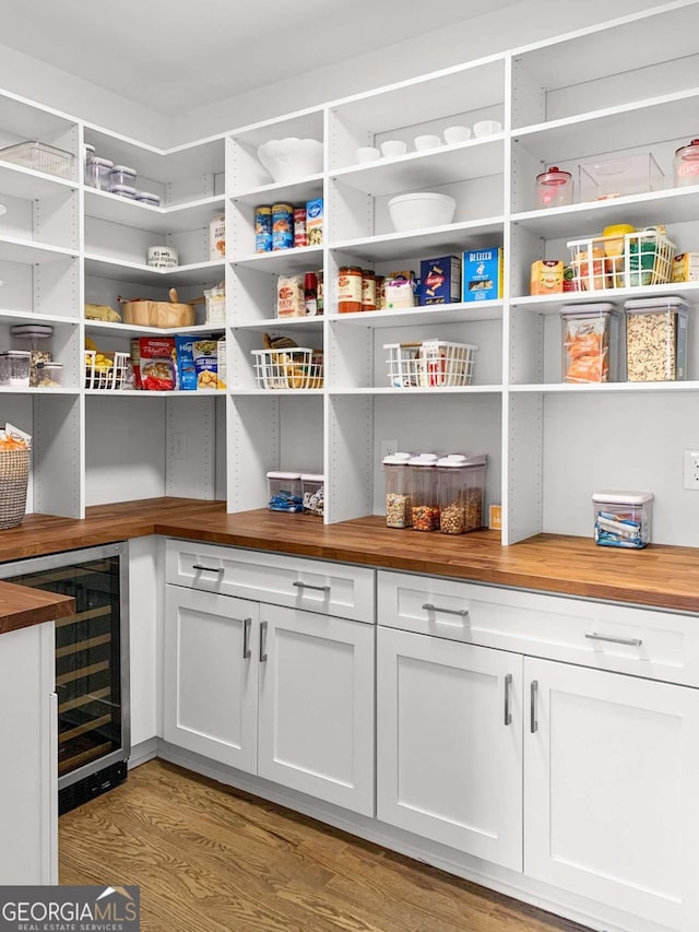 storage area featuring wine cooler