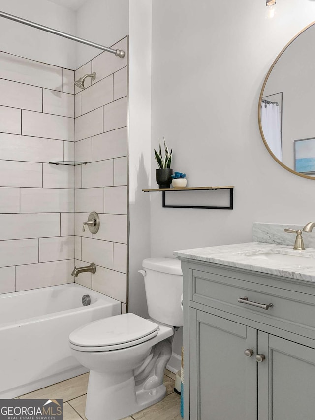 full bathroom with toilet, tile patterned floors, shower / tub combo, and vanity