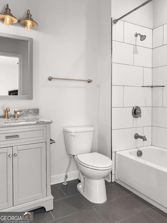 bathroom featuring tile patterned floors, shower / bathtub combination, vanity, and toilet