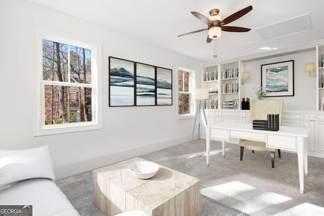 home office with carpet floors, ceiling fan, plenty of natural light, and attic access