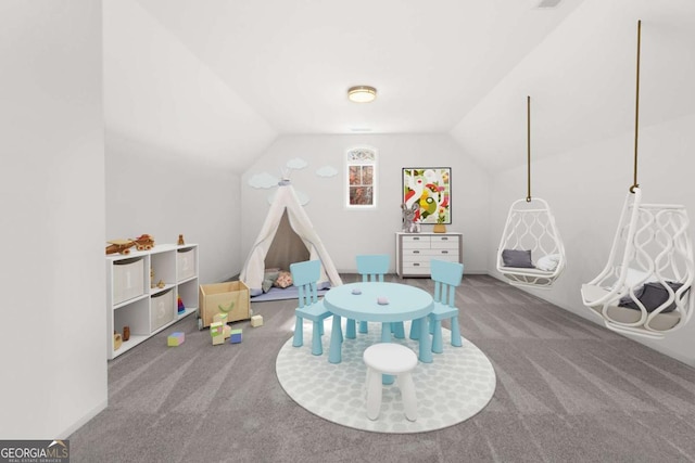 rec room with carpet and vaulted ceiling
