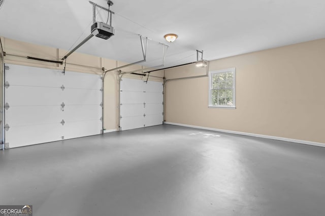 380 Grady Ave, Fayetteville, GA 30214 - garage featuring baseboards and a garage door opener
