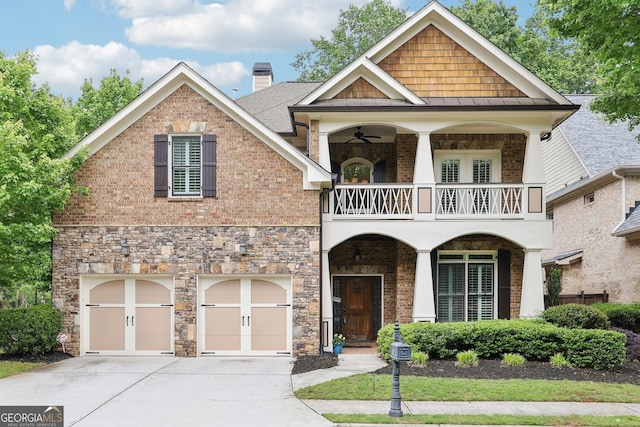 view of front of house featuring an attached garage, a chimney, concrete driveway, a balcony, and covered porch