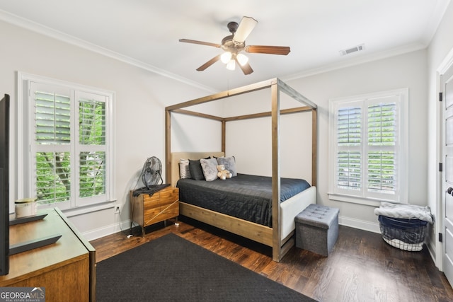 bedroom with visible vents, ornamental molding, baseboards, and dark wood-type flooring
