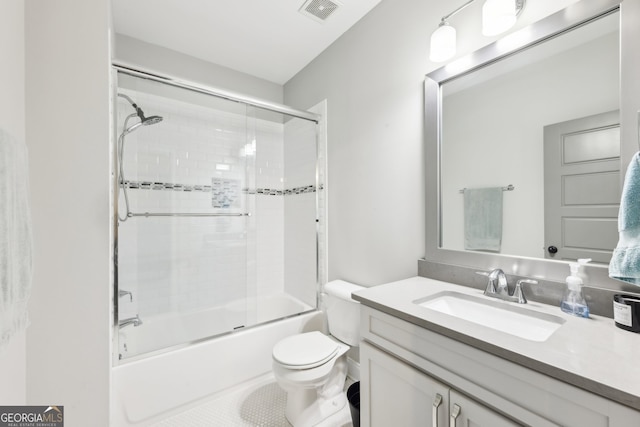 bathroom with visible vents, tile patterned flooring, vanity, bath / shower combo with glass door, and toilet