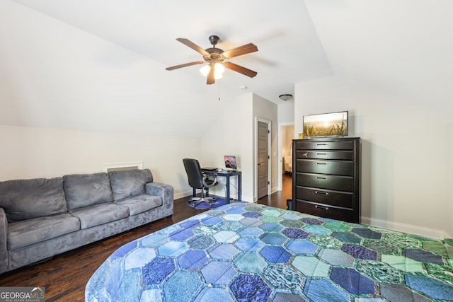 bedroom with baseboards, vaulted ceiling, and dark wood-style flooring