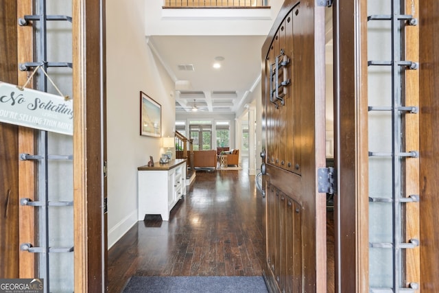 corridor with recessed lighting, baseboards, visible vents, dark wood-style floors, and coffered ceiling