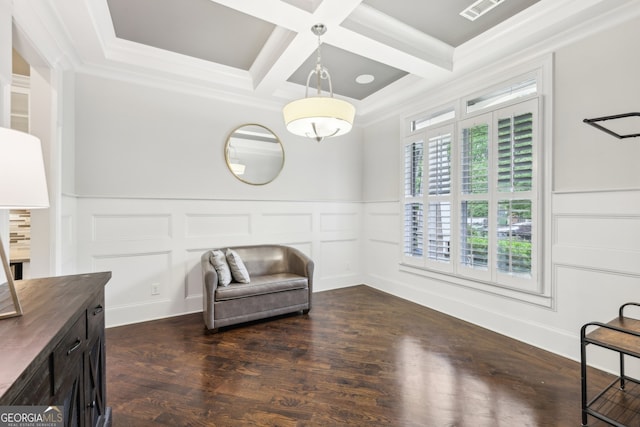 sitting room with visible vents, wainscoting, a decorative wall, beam ceiling, and coffered ceiling