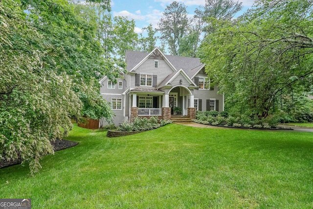 150 Shady Grove Ln, Alpharetta, GA 30009 - view of front of home featuring covered porch and a front lawn