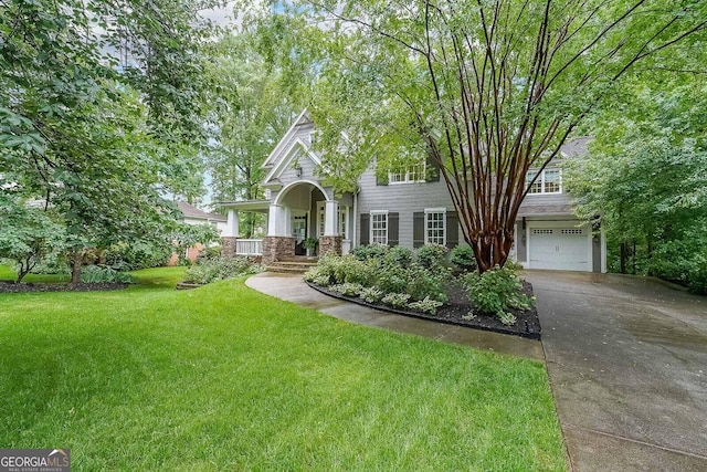 150 Shady Grove Ln, Alpharetta, GA 30009 - view of front of house featuring concrete driveway, a garage, and a front yard