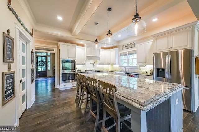 150 Shady Grove Ln, Alpharetta, GA 30009 - kitchen with appliances with stainless steel finishes, crown molding, dark wood finished floors, decorative backsplash, and a center island