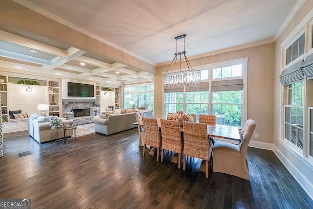 150 Shady Grove Ln, Alpharetta, GA 30009 - dining area with ornamental molding, dark wood finished floors, plenty of natural light, a chandelier, and a stone fireplace