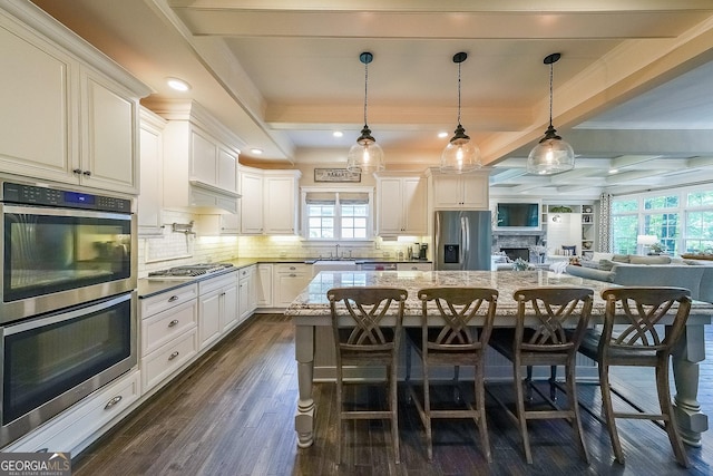 150 Shady Grove Ln, Alpharetta, GA 30009 - kitchen with stainless steel appliances, dark wood finished floors, beamed ceiling, plenty of natural light, and tasteful backsplash