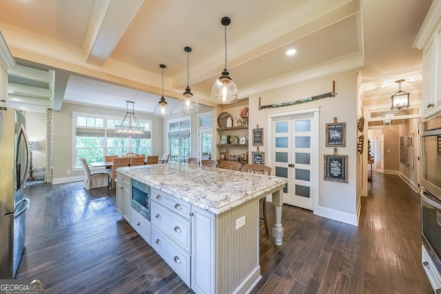 150 Shady Grove Ln, Alpharetta, GA 30009 - kitchen with appliances with stainless steel finishes, a kitchen breakfast bar, dark wood-style flooring, ornamental molding, and white cabinets