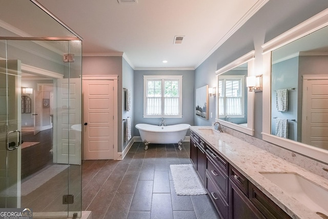 150 Shady Grove Ln, Alpharetta, GA 30009 - bathroom featuring double vanity, a soaking tub, a shower stall, crown molding, and baseboards