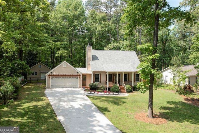 single story home featuring a garage, fence, a chimney, concrete driveway, and a front lawn