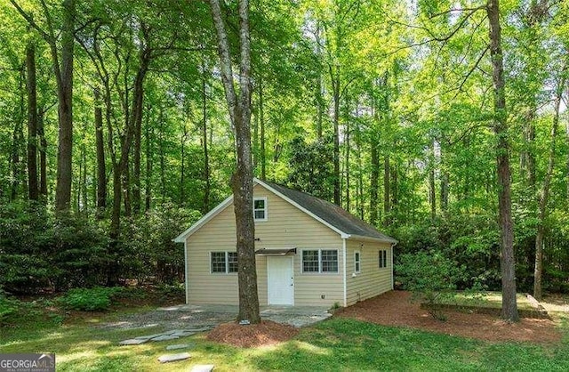 garage featuring a wooded view