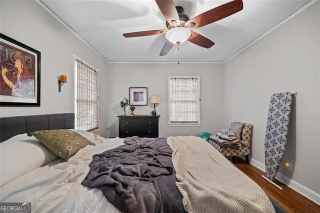 1941 Headland Dr, East Point, GA 30344 - bedroom featuring crown molding, baseboards, ceiling fan, and dark wood-style floors