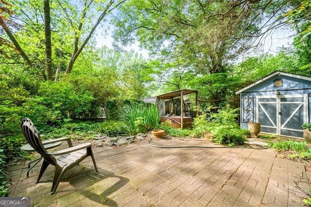 1941 Headland Dr, East Point, GA 30344 - wooden terrace with a patio, a jacuzzi, an outbuilding, and a shed