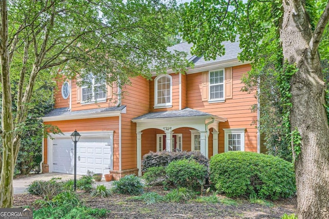 1259 Crescentwood Ln, Decatur, GA 30032 - traditional-style house featuring an attached garage, concrete driveway, roof with shingles, and a porch