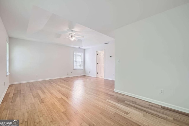 1259 Crescentwood Ln, Decatur, GA 30032 - unfurnished room with a ceiling fan, baseboards, a raised ceiling, and light wood-type flooring