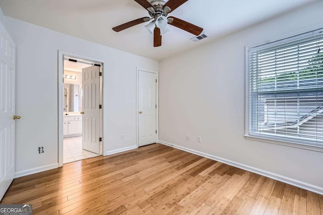 1259 Crescentwood Ln, Decatur, GA 30032 - unfurnished bedroom featuring baseboards, light wood finished floors, and visible vents