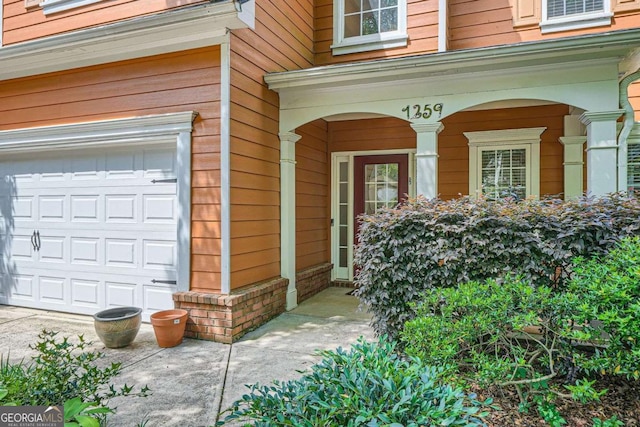 1259 Crescentwood Ln, Decatur, GA 30032 - property entrance with covered porch and an attached garage