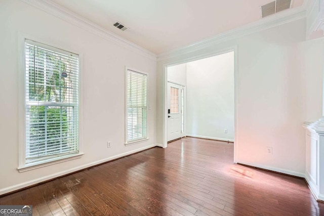 1259 Crescentwood Ln, Decatur, GA 30032 - spare room with visible vents, ornamental molding, and hardwood / wood-style flooring