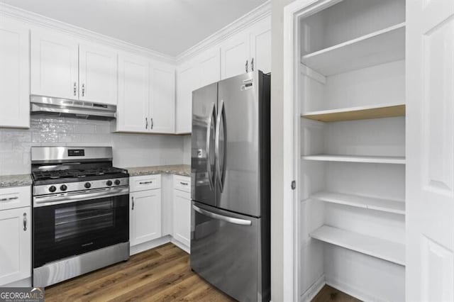 kitchen with appliances with stainless steel finishes, under cabinet range hood, white cabinetry, and dark wood-style floors