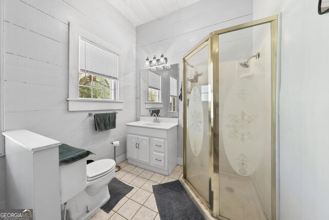 full bathroom with vanity, tile patterned floors, toilet, and a shower stall