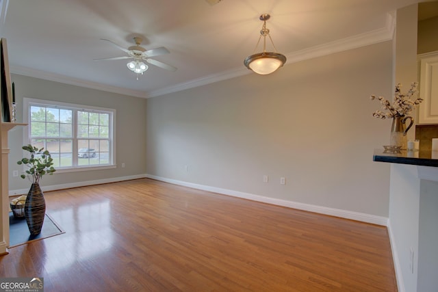 3204 Village Blvd SE, Rome, GA 30161 - unfurnished living room with light wood finished floors, ceiling fan, and crown molding