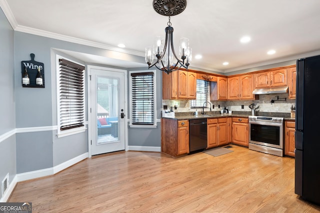 96 Grover Way, Dallas, GA 30157 - kitchen featuring black appliances, under cabinet range hood, a chandelier, crown molding, and light wood-style floors