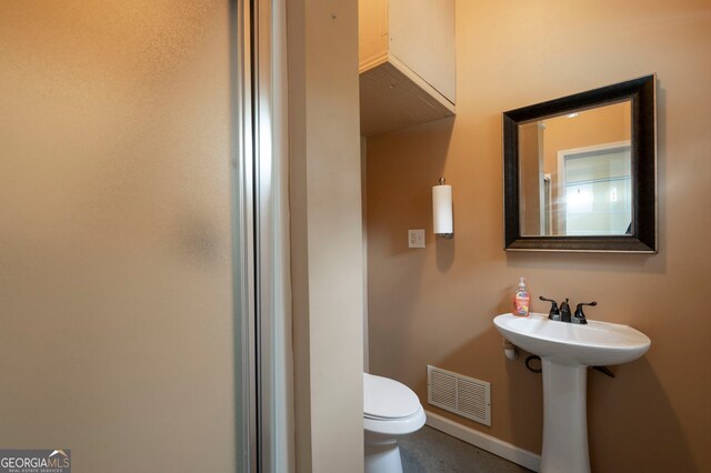 96 Grover Way, Dallas, GA 30157 - bathroom with toilet, a sink, and baseboards