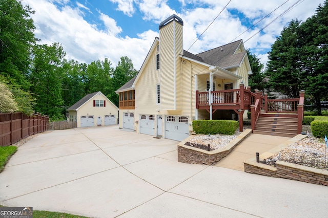 96 Grover Way, Dallas, GA 30157 - view of property exterior with stairs, fence, a chimney, driveway, and a garage