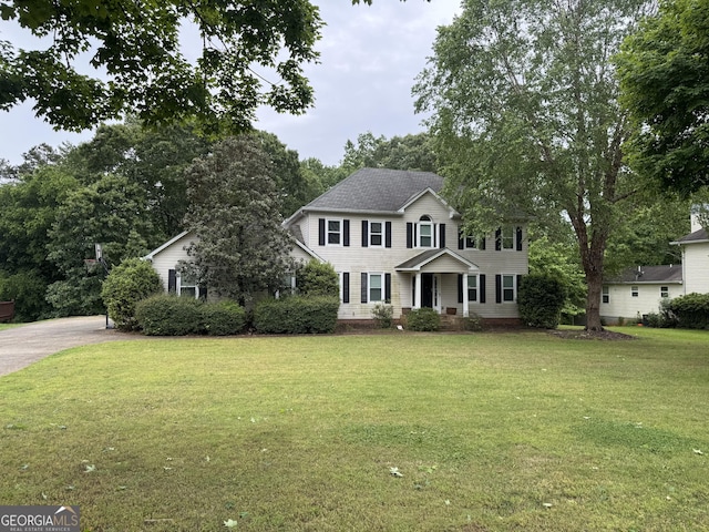 colonial home with a front yard