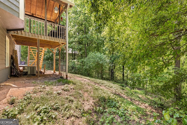 588 Peachtree Dr SE, White, GA 30184 - view of yard featuring stairs and a wooden deck