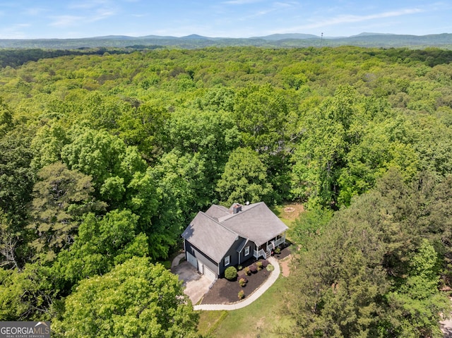 588 Peachtree Dr SE, White, GA 30184 - bird's eye view of a heavily wooded area and a mountainous background