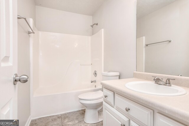 1716 Anniston Dr, Mcdonough, GA 30253 - full bathroom with toilet, vanity, shower / washtub combination, and tile patterned flooring