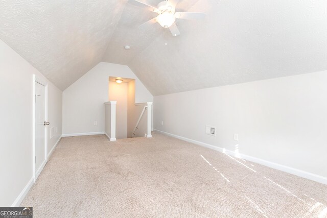 1716 Anniston Dr, Mcdonough, GA 30253 - bonus room featuring carpet, vaulted ceiling, baseboards, and a ceiling fan