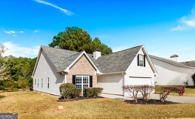 1716 Anniston Dr, Mcdonough, GA 30253 - view of front of home with a garage, a front yard, a shingled roof, and driveway