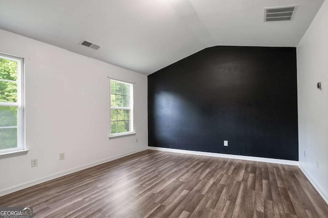 5244 Carrington Park Dr, Powder Springs, GA 30127 - unfurnished room featuring visible vents, baseboards, wood finished floors, and vaulted ceiling
