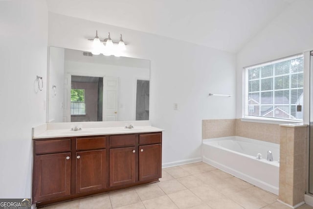 5244 Carrington Park Dr, Powder Springs, GA 30127 - bathroom with double vanity, a bath, a sink, tile patterned floors, and lofted ceiling
