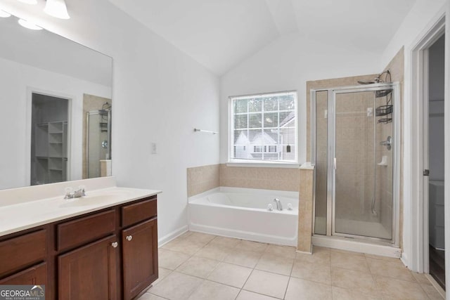 5244 Carrington Park Dr, Powder Springs, GA 30127 - full bathroom with a bath, tile patterned flooring, a stall shower, vanity, and lofted ceiling