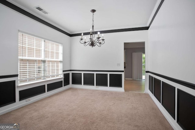 5244 Carrington Park Dr, Powder Springs, GA 30127 - unfurnished room with crown molding, carpet flooring, a notable chandelier, wainscoting, and visible vents