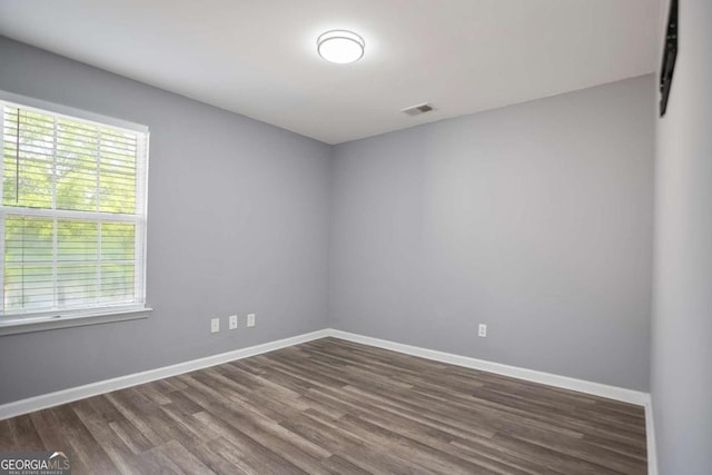 5244 Carrington Park Dr, Powder Springs, GA 30127 - unfurnished room with baseboards, visible vents, and dark wood finished floors