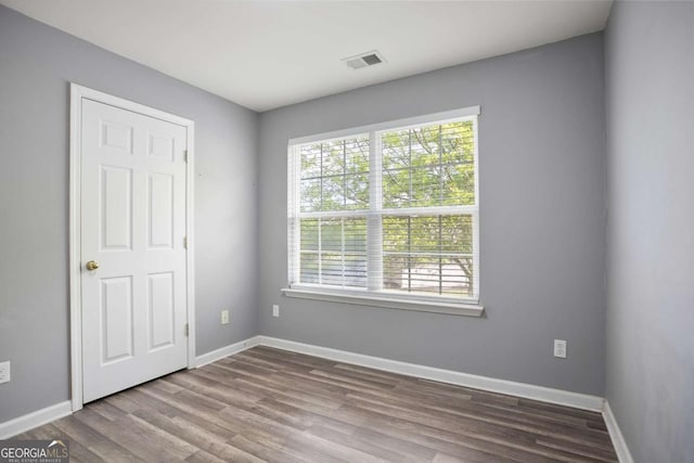 5244 Carrington Park Dr, Powder Springs, GA 30127 - empty room featuring baseboards, wood finished floors, and visible vents