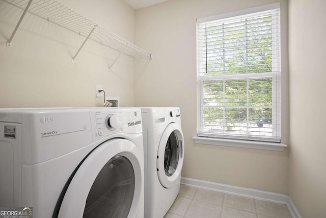 5244 Carrington Park Dr, Powder Springs, GA 30127 - clothes washing area with laundry area, baseboards, plenty of natural light, and washing machine and clothes dryer